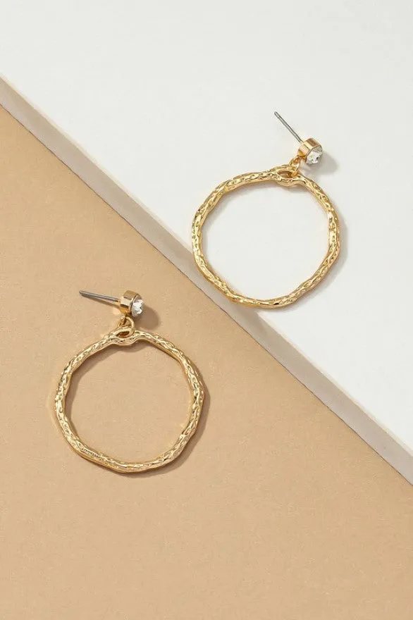 Hammered hoop drop earrings topped by a rhinestone stud